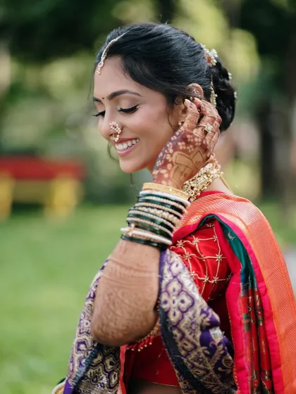 The pure, uninhibited joy of a bride on her wedding day. This close-up on her smiling face captures a moment of genuine happiness and excitement.