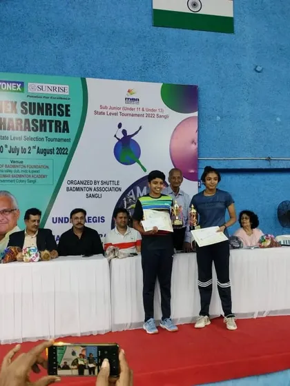 Pranjal and her partner after also winning the U-13 girls' doubles title at the state level tournament. Our training prepares players for success in both singles and doubles formats.