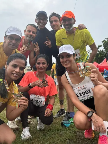 A happy group selfie with finisher medals. The joy and camaraderie after crossing the finish line are what make race days so memorable.