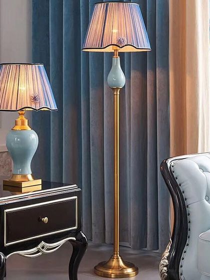 Here is another elegant lamp combo, featuring a soft blue ceramic base and a scalloped pleated shade. This set is perfect for creating a serene and classic atmosphere in a bedroom or formal living area.