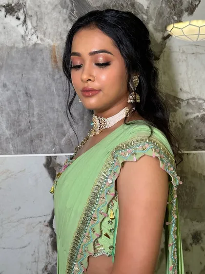 Eyes closed to show the beautiful blend of shimmery eyeshadow. This soft glam look is perfect for a bridesmaid who wants to shine.