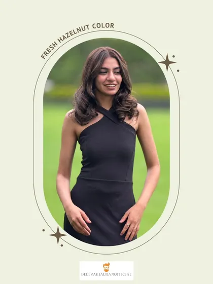 This rich hazelnut hair color, paired with soft curls, creates a look that is both trendy and timeless.
