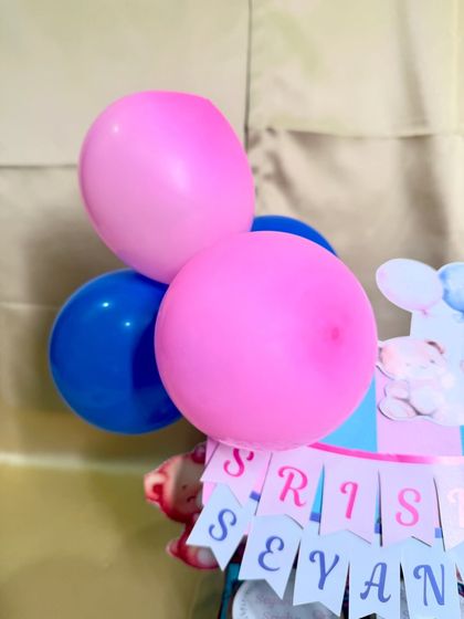 The pink and blue balloons add a festive touch to our twin celebration hampers.