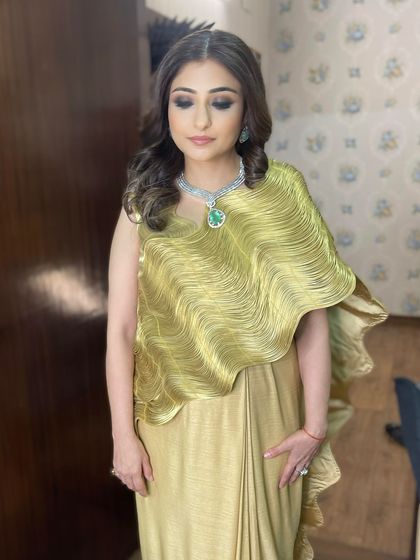 The complete look, showing how the warm smokey eye and soft curls create an aura of effortless elegance.