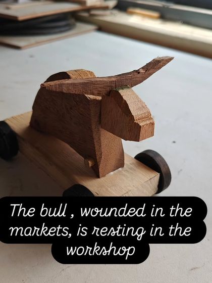 A prototype for a Jallikattu racing game bull, carved from scrap wood. This small project explores form and character, turning a simple block of wood into a dynamic figure.