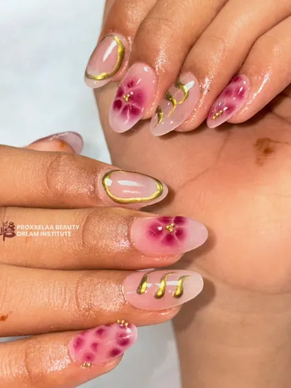 A different angle of the magenta floral design, showing the glossy finish and the way the gold elements catch the light.