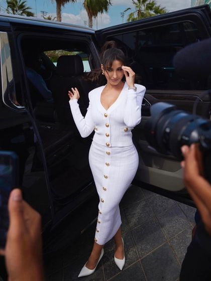 Kicking off the IIFA Awards 2023, I styled Nora Fatehi in this chic and powerful white knit dress from Balmain. It was the perfect choice for a daytime press event, projecting effortless confidence.