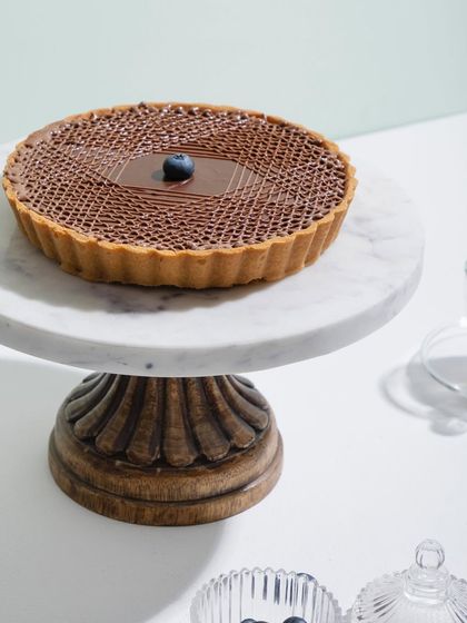 A close-up of our beautiful chocolate tart, a perfect dessert for any chocolate lover.