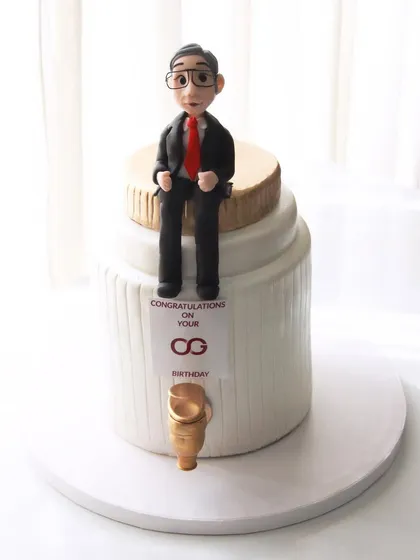 A cake designed for the CEO of Axis Bank, Mr. Amitabh Chaudhry. The design is based on his motto about thinking bigger than a glass, hence the giant jar with a tap.