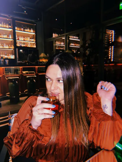 Authenticity is key. Whether I'm reviewing a new cocktail menu or showcasing a lifestyle brand, I immerse myself in the experience. This shot captures a genuine moment of enjoyment, which helps build trust and connection with my audience.