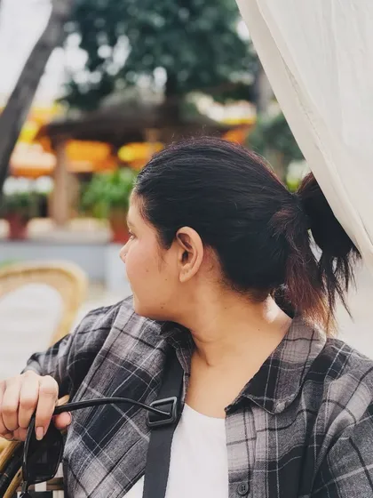 A candid, over-the-shoulder shot of me at a cafe, creating a sense of being there in the moment.