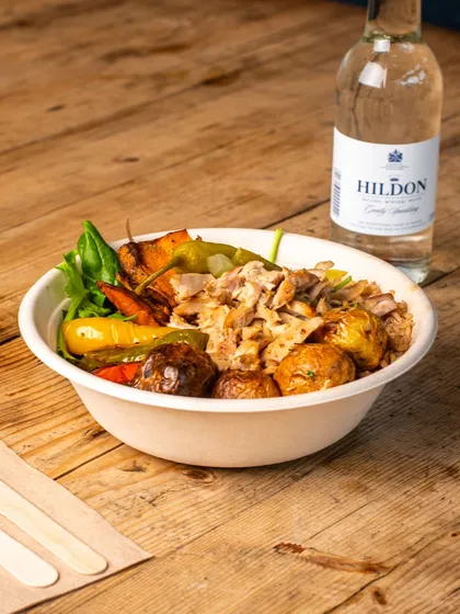 A healthy and appealing lunch bowl, ready to eat. This kind of shot is ideal for a QSR or a healthy cafe's promotional materials.