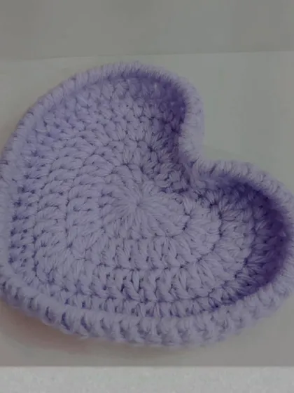 A simple and sweet heart-shaped trinket dish in a lovely lilac color. It's perfect for keeping your tiniest accessories, like rings or earrings, organized on your nightstand.