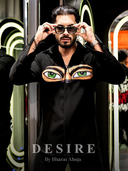 Serving eye-conic looks, literally. This shot captures the playful yet bold attitude of the 'Haters' eyes shirt.