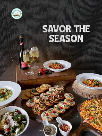 "Savor the Season" with my Italian cuisine platters. This moody shot captures a cozy dinner setup with pasta, bruschetta, pizza, and wine, perfect for a special evening at home.