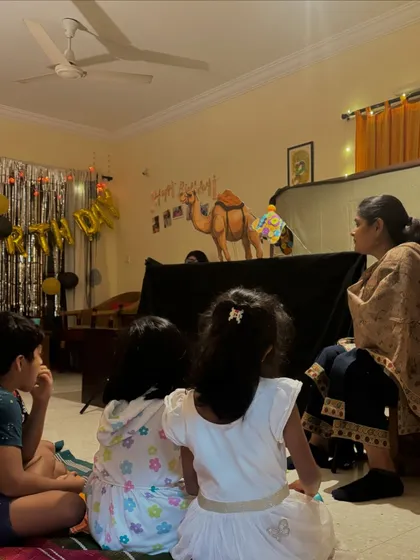 Children captivated by a camel puppet at a birthday party. My interactive puppet shows are a wonderful way to engage young guests and add a touch of magic to any celebration.