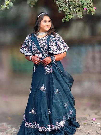 A full-length view of this stunning engagement look. The sparkling AD jewellery provides a beautiful contrast against the dark, floral outfit.