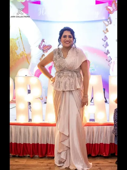 This client chose a beautiful indo-western draped gown with a peplum top for her event. She looks comfortable, happy, and effortlessly chic.