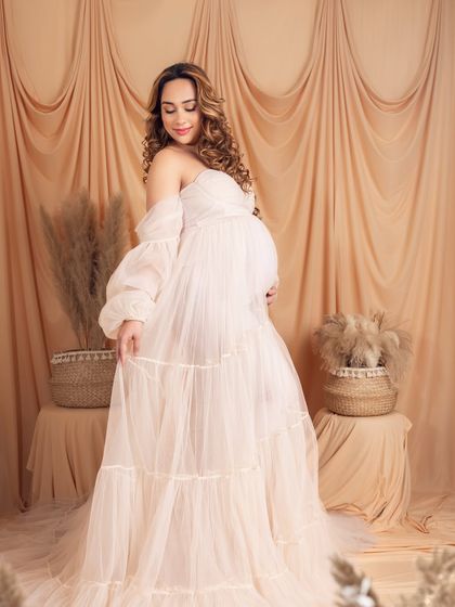 This pose shows the beautiful movement and flow of the delicate, tiered gown.