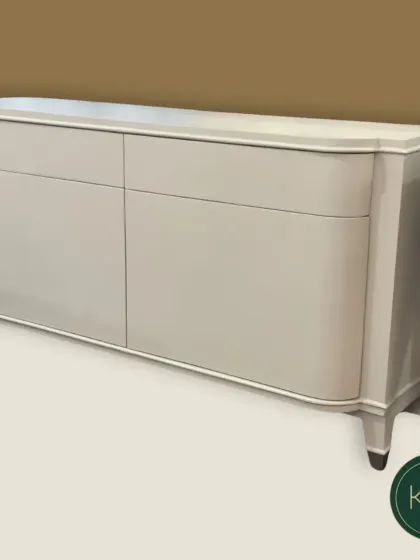 A studio shot of the curved console table, emphasizing its clean lines and elegant form.