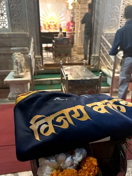 Our jersey outside the temple, ready for a new season of challenges.