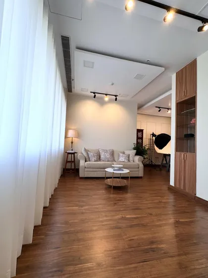 Another view of the studio's living room set, a comfortable and stylish space for lifestyle product shoots.