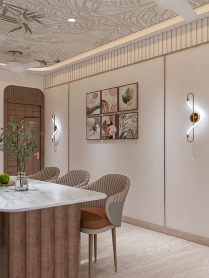 A dining area that combines a marble-top table with textured wooden base and plush, upholstered chairs. The botanical wallpaper on the ceiling adds a unique, artistic element to the room.