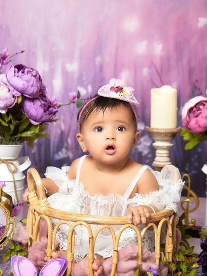 The full setup for the lavender floral theme, complete with vintage milk jugs, candles, and butterflies for an enchanting feel.