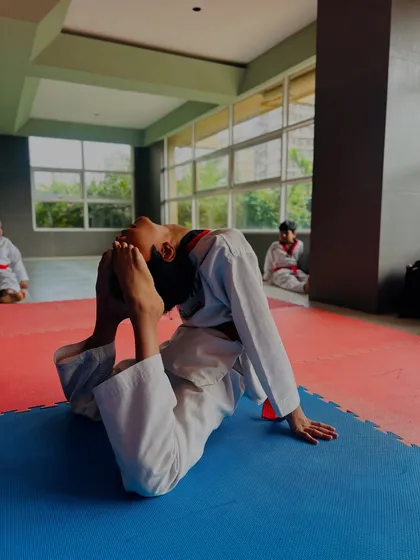 Flexibility training is a key part of our curriculum. This student shows great progress in his backbend flexibility.