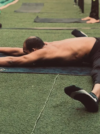 Another view of the pancake stretch, a challenging but rewarding pose for improving hip flexibility.