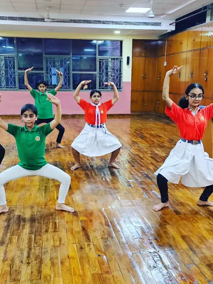 A group of girls holding a Chhau pose. We are proud to see so many young women embracing this powerful martial dance form.