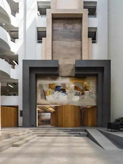 The entrance of the UTI HQ, revisited 27 years after its completion. The design, with its monumental forms and integrated artwork, has stood the test of time.