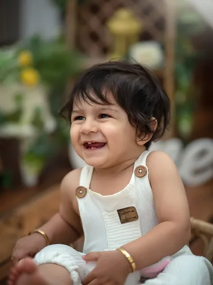That pure, uncontainable joy. This is what we aim for in every child portrait session. By keeping the setup simple, we let your little one's infectious smile and sparkling eyes become the entire story.