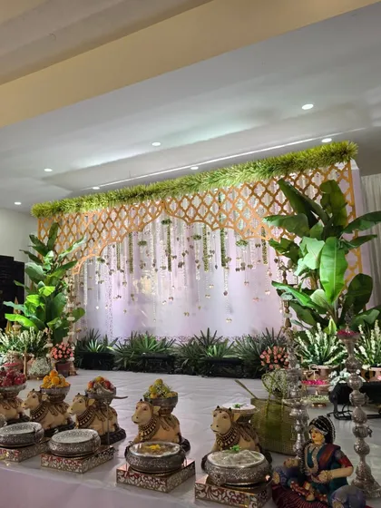 A side view of the stage, showing the row of cow props with offerings.