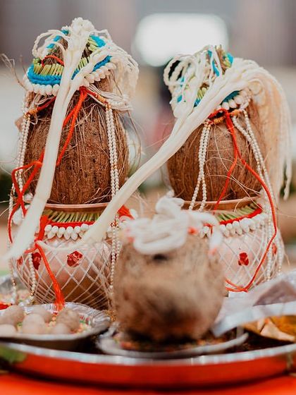 A close-up of the decorated coconuts used in a traditional Maharashtrian wedding puja. We capture the beauty and significance of these ritualistic items.