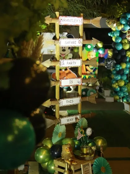 A custom directional sign for "Brantley's Safari Party." The arrow-shaped signs guide guests to the celebration, adding to the fun and thematic experience from the moment they arrive.