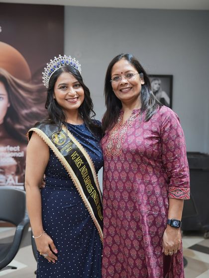 A happy moment between a client and a team member. Building warm relationships with our clients is just as important as the services we provide.