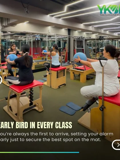 This image captures the focus and energy of a group class using the Pilates chair and stability balls. Being the first to arrive ensures you get your favorite spot!