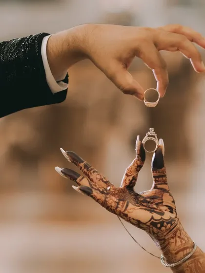 It's the small details that tell the big story. A creative ring shot like this symbolizes your union in an artistic way, showcasing my eye for detail in engagement and wedding photography.