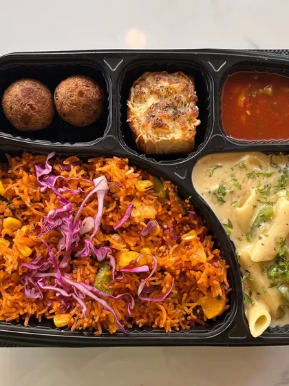 Beyond traditional Indian food, we also offer convenient meal boxes with continental options. This premium meal box features Mexican rice, creamy pasta, and appetizers, perfect for corporate lunches or diverse party menus.