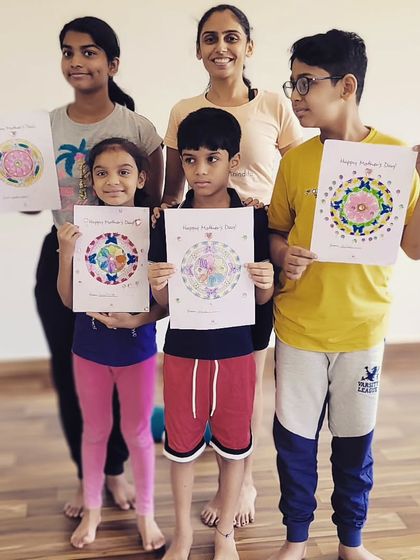Proudly showing off their beautiful mandala creations for Mother's Day. I love combining yoga with art to give children another outlet for self-expression.