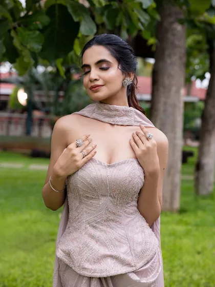 This outfit is perfectly balanced for a cocktail evening. I designed it with a hand-embroidered strapless corset top and a draped pant-sari, creating an effortlessly glamorous and modern silhouette.