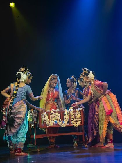 A scene showing the gopis gathered around the cradle of baby Krishna. The gentle lighting and adoring expressions convey a sense of warmth and maternal love.