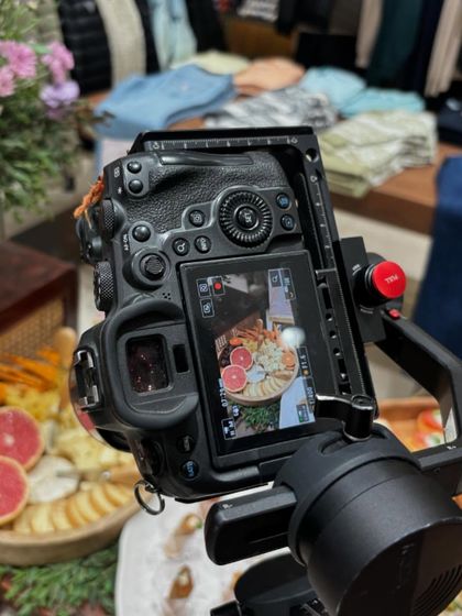 Capturing the details of our grazing board at the GUESS store launch. The camera is positioned to highlight the fresh grapefruit and the variety of cheeses.