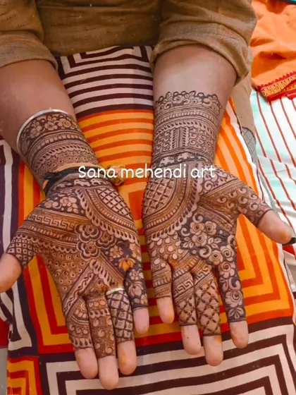 A full, intricate design for a groom who wants to match the bride's elaborate mehendi. This is a bold and beautiful choice.