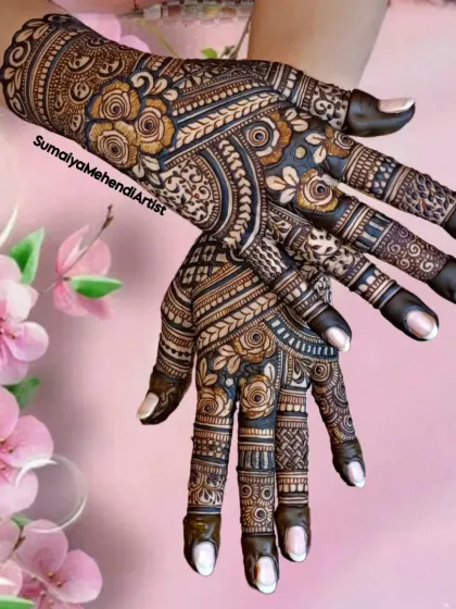 Feeling fabulous with henna! This semi-bridal design has a bit of everything: roses, traditional patterns, and filled fingertips for a classic look.