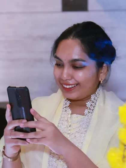 A guest captures her own memory on her phone, a modern touch in a traditional ceremony that I love to document.
