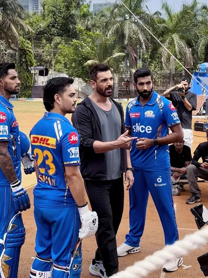 A shot from the Garnier x Mumbai Indians ad shoot, featuring John Abraham with the players. This kind of project provides real-world experience in men's styling and working with high-profile personalities.