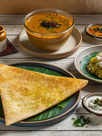 A simple and elegant shot of a plain dosa with accompaniments, for Gulab Sweets.