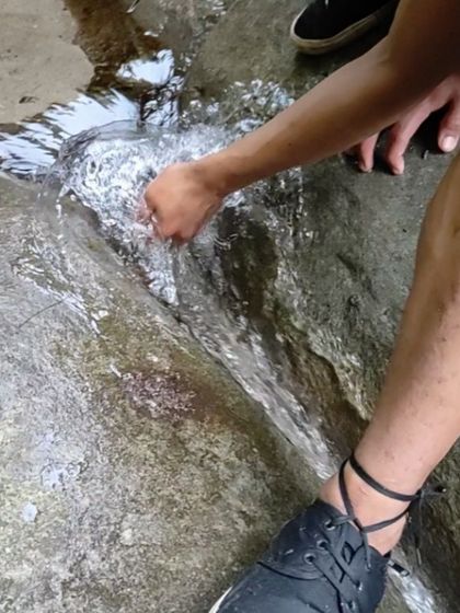 The simple act of feeling the cool, flowing water connects you directly to the environment you're exploring.